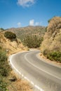 A winding road through mountains on a hot sunny day. Royalty Free Stock Photo