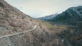 Winding road in mountains,mountains in background,shooting with the drone