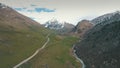 Winding road in mountains,mountains in background,shooting with the drone