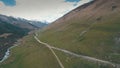 Winding road in mountains,mountains in background,shooting with the drone