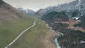 Winding road in mountains,mountains in background,shooting with the drone