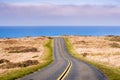 Winding road on the Pacific Ocean coastline on a clear sunny day, Point Reyes National Seashore, California Royalty Free Stock Photo