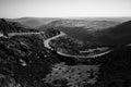 A winding road in the Serra da Estrela, Portugal. Black and white photo. Royalty Free Stock Photo