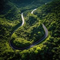 Winding road, top view of beautiful aerial view of asphalt road, highway through forest. For traveling and driving in