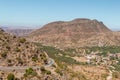 Winding road with trees in red Atlas Mountains Royalty Free Stock Photo