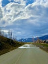 Winding road through the village to the foot of the Ural Mountains Royalty Free Stock Photo