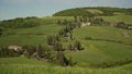 Picturesque tuscan landscape with winding road and cypress trees in Orchi Valley