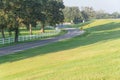 Winding road with white fence and live oak tree in Louisiana Royalty Free Stock Photo