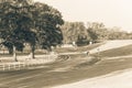 Winding road with white fence and live oak tree in Louisiana Royalty Free Stock Photo