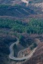 Winding roadway passes through a rural landscape. Royalty Free Stock Photo