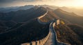 Winding through rugged mountains, the Great Wall of China is captured at sunset. It Royalty Free Stock Photo