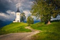 Winding rural road and Saint Primoz mountain church, Jamnik, Slovenia