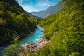 Winding Soca river in the green forest near Kobarid, Slovenia