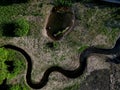 winding stream with ponds. people renewed the zigzagging cance