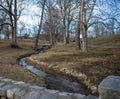 Winding Stream with a stone bridge in foreground