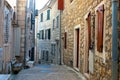 Winding street of the authentic, old town of Herceg Novi, Montenegro. We see old houses and very narrow