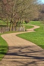 Winding track leads through parkland.