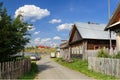 Winding village street along the lake. Village of Visim, Sverdlovsk region, Russia Royalty Free Stock Photo