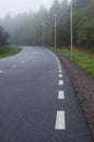 Winding walkway and cycle path on foggy morning Royalty Free Stock Photo