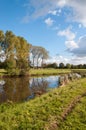 A windless autumn day at a narrow river