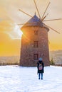 Windmill in Altinkoy in the sunset with rear view of a girl, Ankara/Turkey