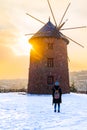 Windmill in Altinkoy in the sunset with rear view of a girl, Ankara/Turkey