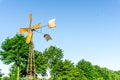 Windmill as a water pump in front Royalty Free Stock Photo