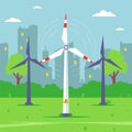 A windmill in the background of the city extracts electricity from the wind. Royalty Free Stock Photo