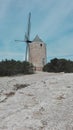 Windmill built in stones on a bare barren hill of formentera