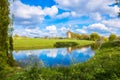 Windmill and channel, Dutch landscape. Royalty Free Stock Photo