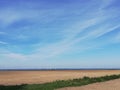 cloud grass sky field agriculture summer Germany Northrhine-Westphalia windmill Royalty Free Stock Photo