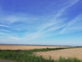 cloud grass sky field agriculture summer Germany Northrhine-Westphalia windmill Royalty Free Stock Photo