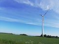 Windmill cloud grass sky blue sustainable energy summer Germany Northrhine-Westphalia Royalty Free Stock Photo