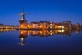 The windmill De Adriaan, Haarlem, Netherlands. Historic buildings. Cityscape during the blue hour. Royalty Free Stock Photo