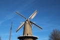 Windmill de Roode Leeuw along the Turfsingel in Gouda with sails on it in the Netherlands. Royalty Free Stock Photo