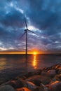 Windmill in Denmark at contrastive sunset blue dark sky Royalty Free Stock Photo