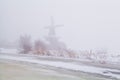 Windmill in dense fog Royalty Free Stock Photo