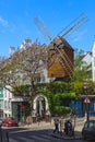 Windmill of the district of Montmartre in Paris. Royalty Free Stock Photo