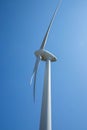 Windmill for electricity generation the background of a blue sky.