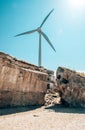 Windmill for electricity generation and ruins of the sea fort in Liepaja