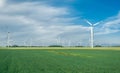 Windmill farm on an agricultural field on the North Sea coastline, Germany