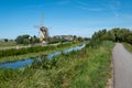 Windmill and farm along the canal on a near Maasland, the N Royalty Free Stock Photo