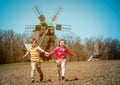 Windmill farm landscape. Netherlands village. Old wooden wind mills at Pirogovo ethnographic museum in near Kyiv Royalty Free Stock Photo