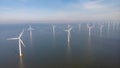Huge windmill turbines, Offshore Windmill farm in the ocean Westermeerwind park , windmills isolated at sea on a Royalty Free Stock Photo