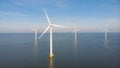 Huge windmill turbines, Offshore Windmill farm in the ocean Westermeerwind park , windmills isolated at sea on a