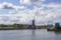 Windmill farm river landscape. Windmill farm scene. Village windmill farm river. Windmill farm river view