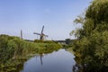 Windmill farm river landscape. Windmill farm scene. Village windmill farm river. Windmill farm river view Royalty Free Stock Photo