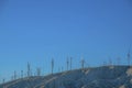 Windmill farm on top of a desert mountain in California Royalty Free Stock Photo