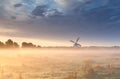 Windmill in fog at sunrise Royalty Free Stock Photo
