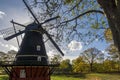 The windmill, framed by tree branches Royalty Free Stock Photo